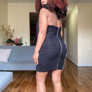 Black backless dress with fringe around chest